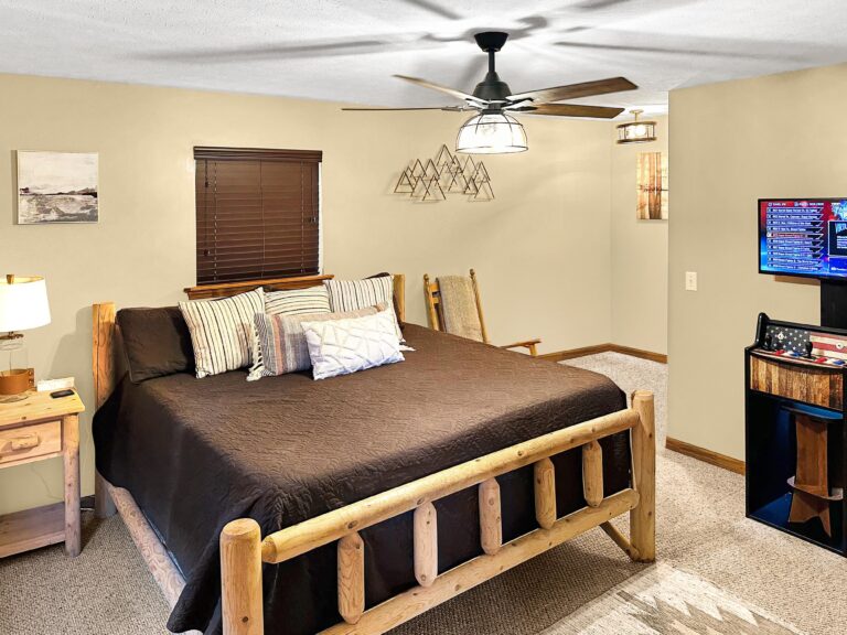 King Master Suite #2 with arcade, box fan, dresser, rocking chair, 36" dog crate, smart TV +