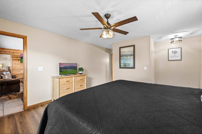 King Master Suite #1 with desk, chair, box fan, dresser, 36" dog crate, smart TV +