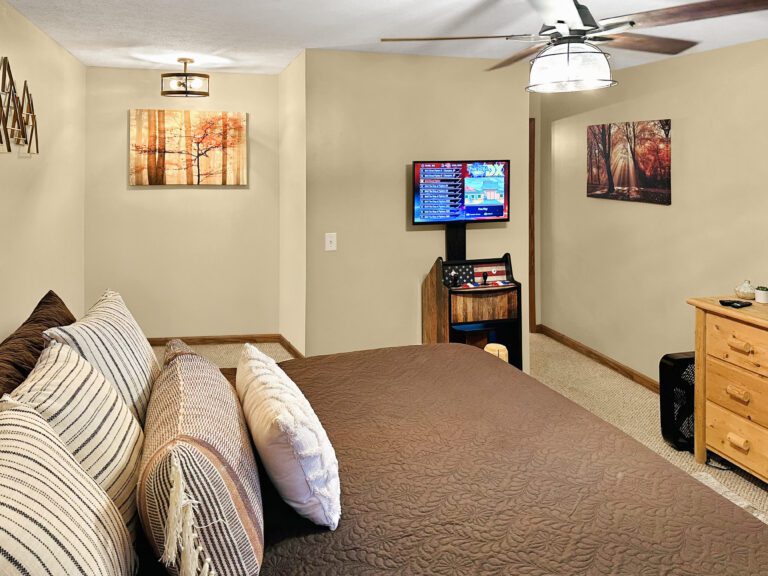 King Master Suite #2 with arcade, box fan, dresser, rocking chair, 36" dog crate, smart TV +