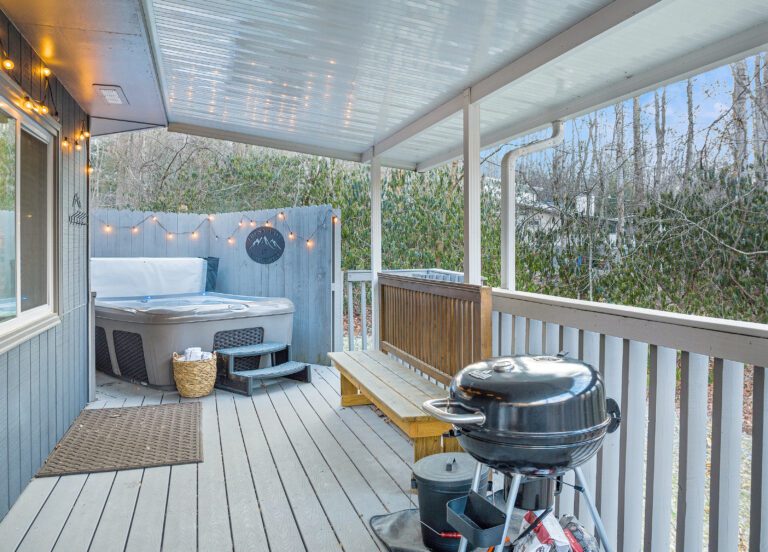 Hot Tub and charcoal grill on covered and gated porch. Bring your own charcoal.